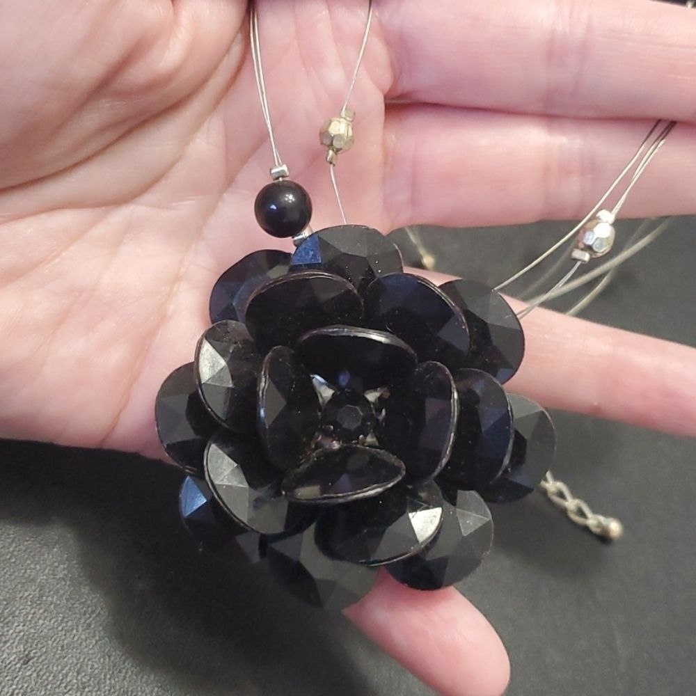 Silver tone black flower floating necklace 18-20"